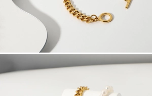 Detail of gold Cuban link OT buckle bracelet and matching pearl ring on geometric props
