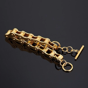 Detail of gold-plated stainless steel double-row bike chain bracelet with T-bar clasp