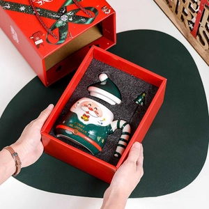 Ceramic Santa mug set with lid and spoon in festive red gift box with golden handle