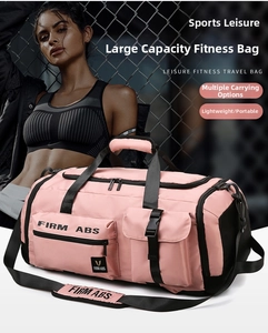 Pink fitness travel bag detail showing heavy-duty buckles and firm abs shoulder strap
