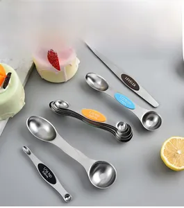 Macro shot of magnetic stainless steel measuring spoons with colorful silicone grips