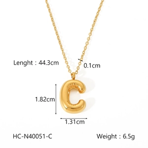 Detail view of golden bubble letter C pendant showing dimensions and necklace measurements