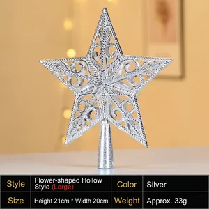Close-up of large 20cm silver hollowed flower star topper for Christmas tree decoration