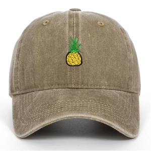 Close-up of pineapple embroidery on khaki washed cotton vintage baseball cap