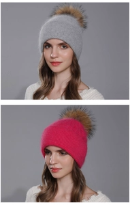 Detail of winter knit angora beanies featuring chunky cable patterns and fluffy fur pom-poms