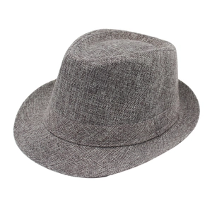 Detailed macro view of woven grey-brown jazz trilby hat with textured mesh weave