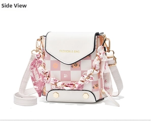 Side view of pink checkerboard mini crossbody bag with cat patterns and silk scarf handle