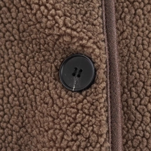 Brown fleece jacket with premium black button detail and textured leather trim edging