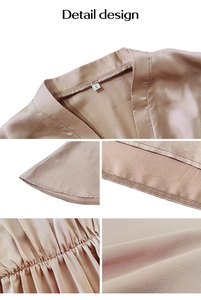 Detailed close-up of champagne satin dress showing collar, cuffs and waist stitching details