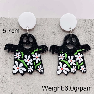 Ghost earrings detail with measurements, white flower patterns on black acrylic surface