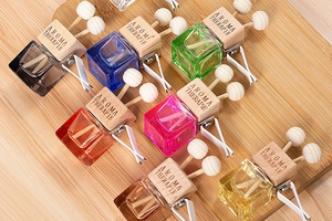 Multi-colored square glass car perfume bottles with wooden caps and air vent clips