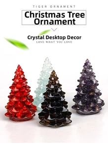 Macro view of four crystal Christmas tree ornaments in red, blue, amber and purple stones
