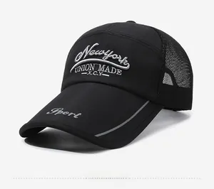 Detail of black mesh baseball cap showing 3D New York embroidery and reflective brim edge