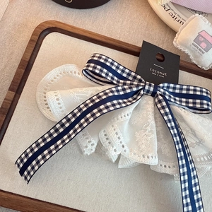 Elegant Korean navy plaid bow hair clip with white lace trim on branded display card