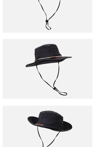 Détail du cordon réglable et des œillets de ventilation sur le chapeau noir