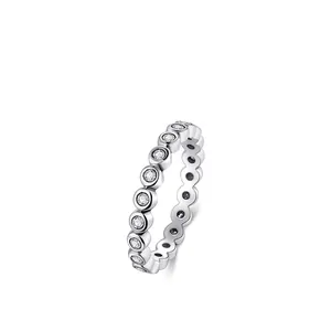 Minimalist S925 sterling silver eternity ring featuring bezel set round cubic zirconia stones