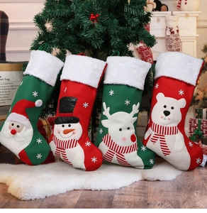 Detail of four festive Christmas stockings with Santa, reindeer, and snowman 3D characters