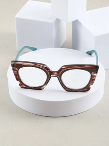 Detailed view of cat-eye frames featuring brown tortoiseshell pattern and teal blue temples