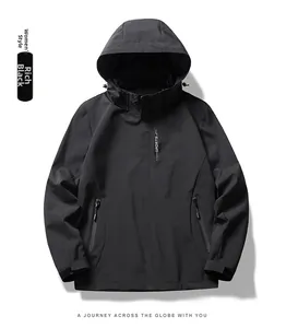Close-up of a black waterproof hooded jacket with high collar and zipper pockets