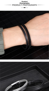 Detail of multi-layer leather and woven bracelets with stainless steel magnetic clasps