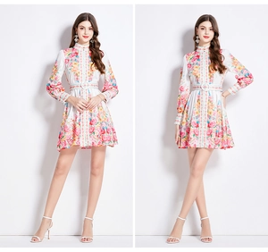 Detail of vintage floral mini dress with stand collar and lantern sleeves for women