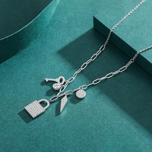 S925 sterling silver lock and key pendant necklace with zircon on emerald display