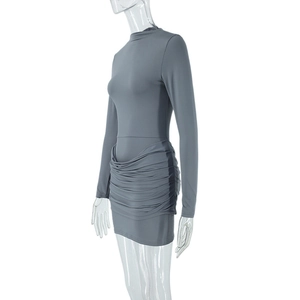 Detail of the elegant ruched draping on a grey long sleeve bodycon dress for women