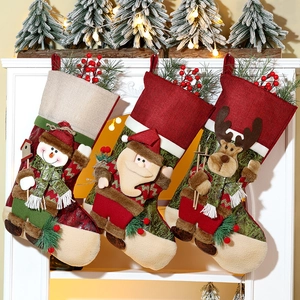Three festive Christmas stockings with 3D Santa, Snowman and Reindeer on a fireplace