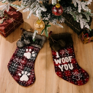 Set of two plaid pet Christmas stockings with faux fur trim and paw print embroidery