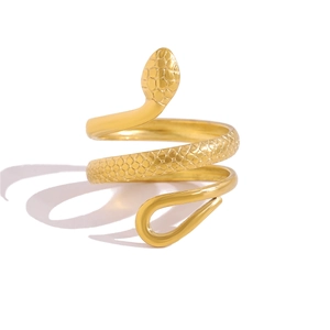 Close-up detail of golden snake wrap ring featuring intricate scale textures on a white background
