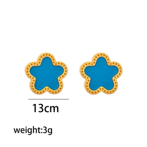 Detailed view of gold stainless steel stud earrings with blue flower petals, 13mm size