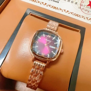 Detail of rose gold square watch with purple gradient dial and date-day display window