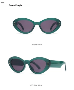 Detail view of retro cat-eye sunglasses with dark green frames and purple lenses