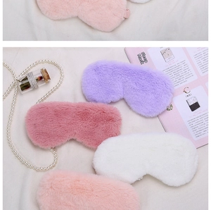 Detailed flat lay of plush sleep masks in pink, purple and white with soft furry texture