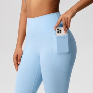 High-waisted light blue yoga leggings with side phone pockets and a lifting design
