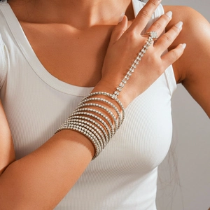 Macro detail of silver multilayer rhinestone bracelet ring combo with sparkling crystals