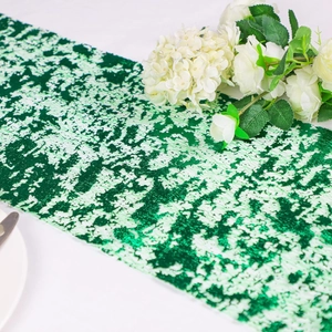 Detail of green sequin table runner with polyester mesh texture for wedding decor
