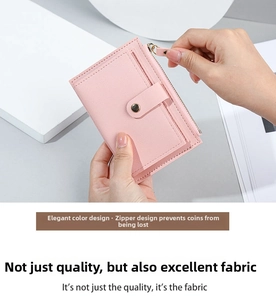 Detailed shot of pink leather wallet featuring multi-slot card holder and zipper pocket