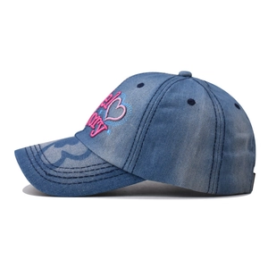 Classic washed blue denim baseball cap featuring pink Angel Story heart embroidery
