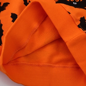 Kids orange Halloween sweatshirt featuring black bat prints and warm fleece lining detail