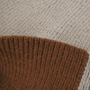 Outdoor winter knit beanie with brown ribbed texture and grey color-blocking detail
