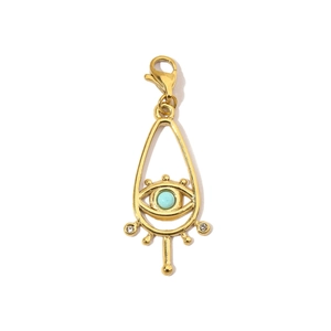 Detail of golden hollow evil eye pendant with turquoise stone and lobster clasp