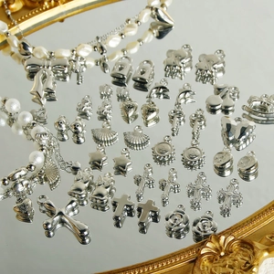 Y2K silver pendants collection with butterfly and heart shapes for DIY jewelry making