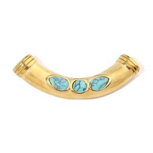 Close-up of golden curved tube pendant with turquoise stones on white background