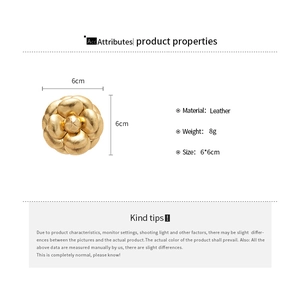 Detailed view of handmade leather flower brooch with gold finish, size 6x6cm