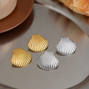 Polished shell-shaped stainless steel stud earrings in gold and silver finish