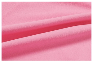 Macro shot of breathable pink quick-dry fabric texture for high-performance yoga set