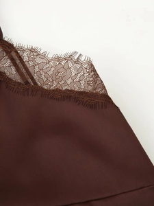 Detail of coffee brown satin camisole showing delicate lace eyelash trim and glossy texture