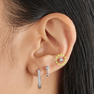 Close-up of S925 sterling silver earrings with round and rectangular cubic zirconia stones