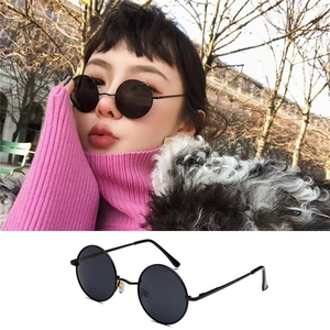 Classic round polarized sunglasses with black metal frames and dark lenses for retro style